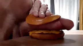 Robust randy teen fucks a burger with a big unearth and cums in it