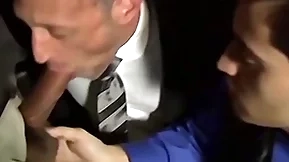 Bald bearded stud sucking team a few cocks in an orgy